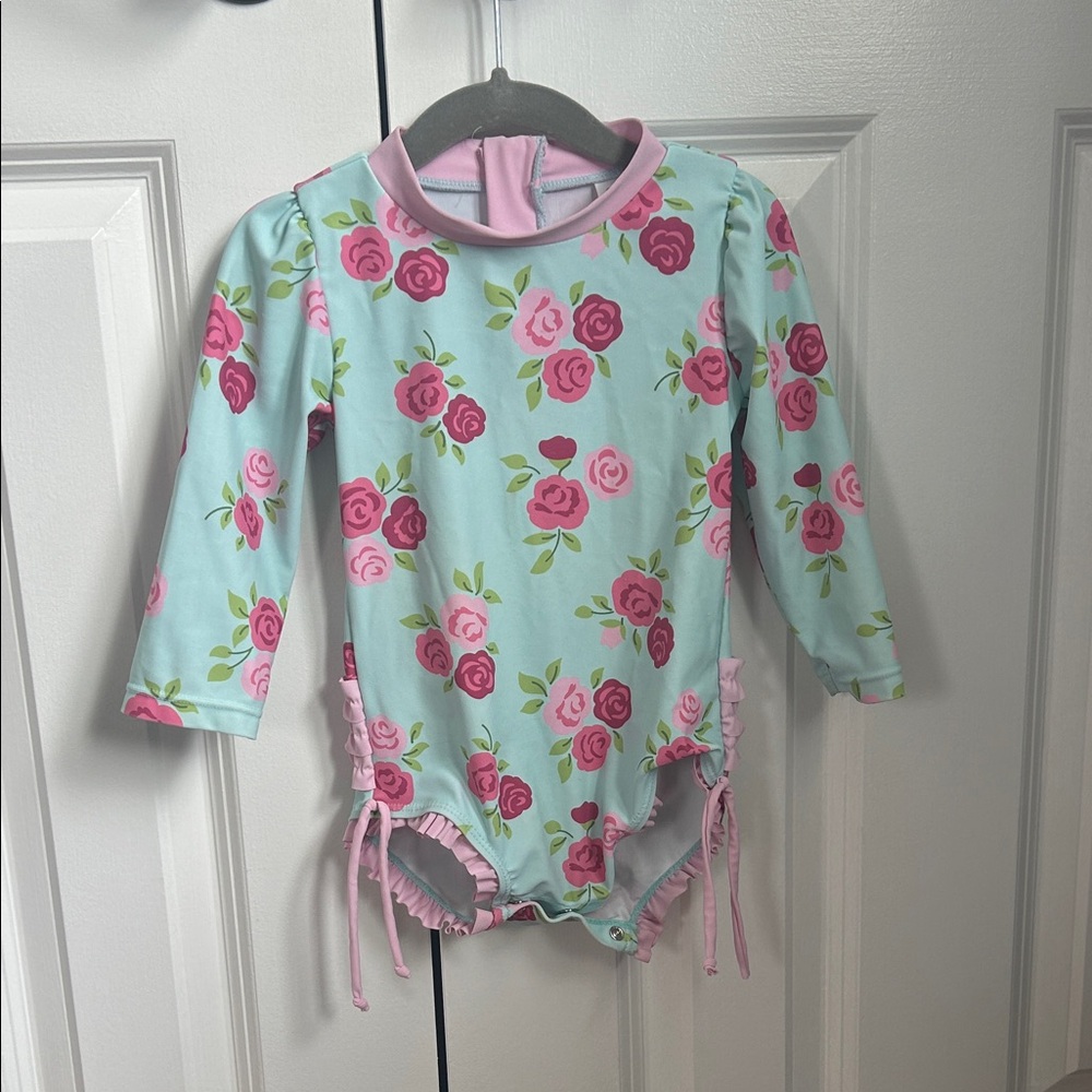 Hudson Baby Pink Rose Print Long-Sleeve One-Piece Swimsuit on Light Blue